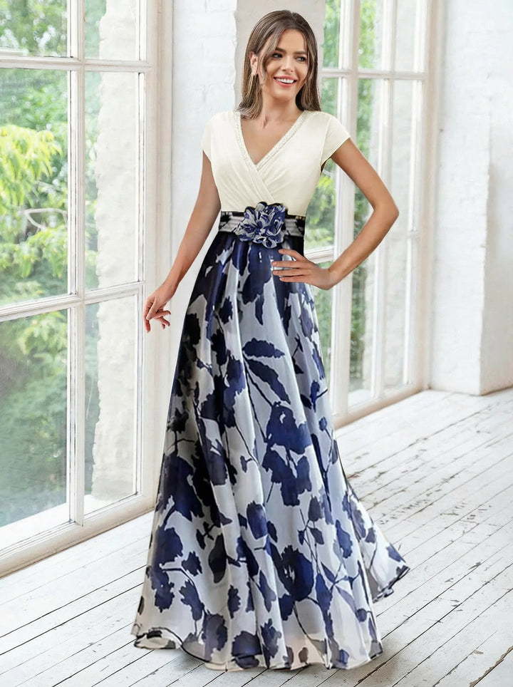 Elegant navy A-line mother of the bride dress featuring floral embellishments and a flattering V-neck design, perfect for special occasions. 5