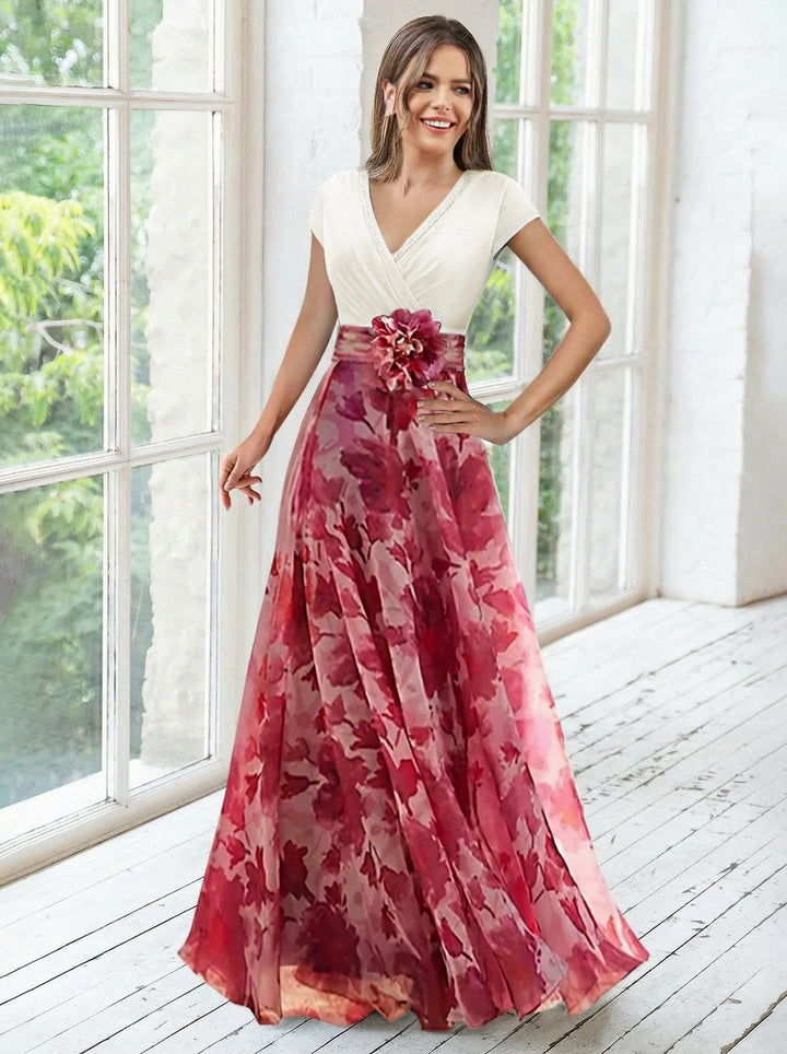 Elegant navy A-line mother of the bride dress featuring floral embellishments and a flattering V-neck design, perfect for special occasions. 6