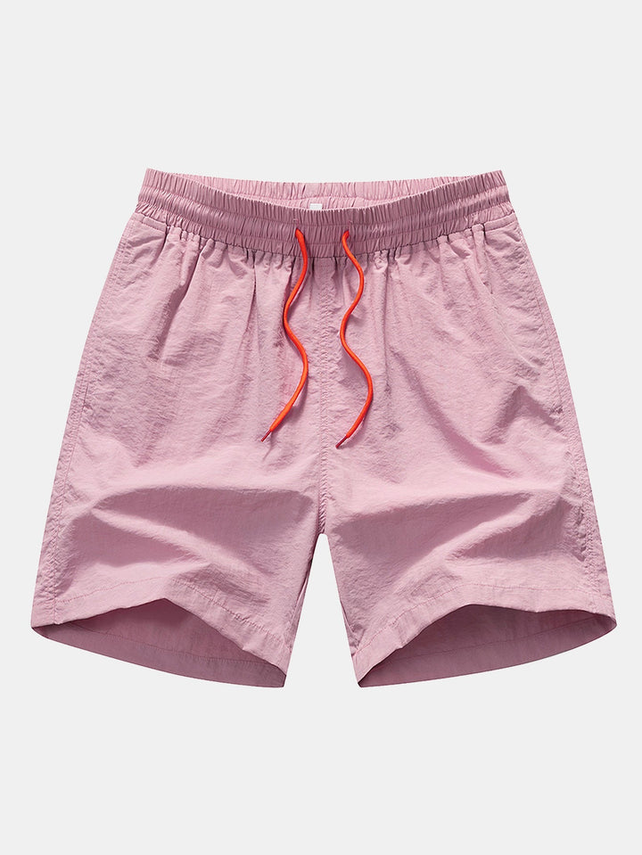 Lightweight polyester beachwear set featuring a vibrant palm tree and flamingo print, includes a stylish shirt and comfortable nylon swim shorts, perfect for summer days 5
