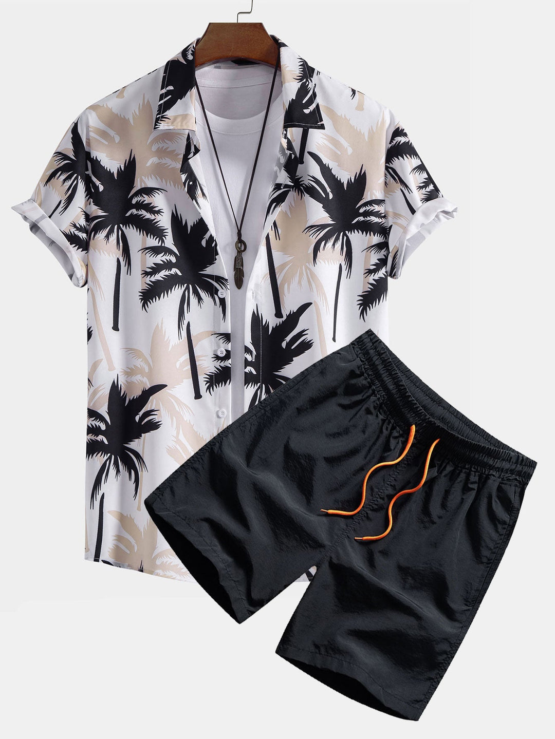 Beachwear set featuring a unique palm tree print, designed for comfort with a regular fit, includes a 100% polyester shirt and 100% nylon 0