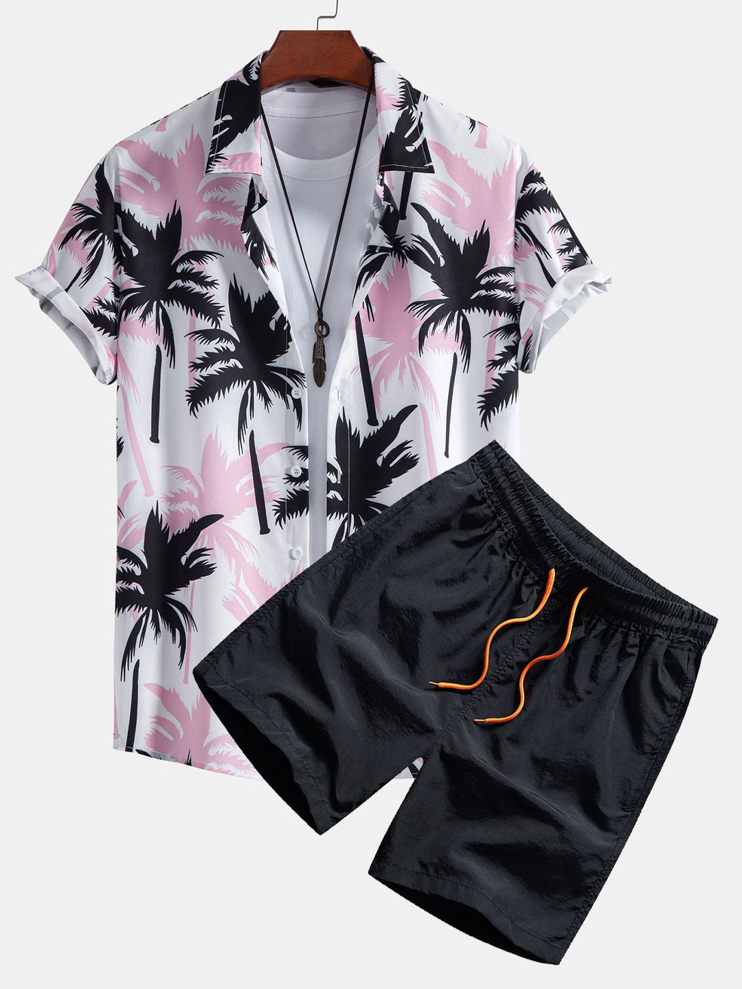 Beachwear set featuring a unique palm tree print, designed for comfort with a regular fit, includes a 100% polyester shirt and 100% nylon 2