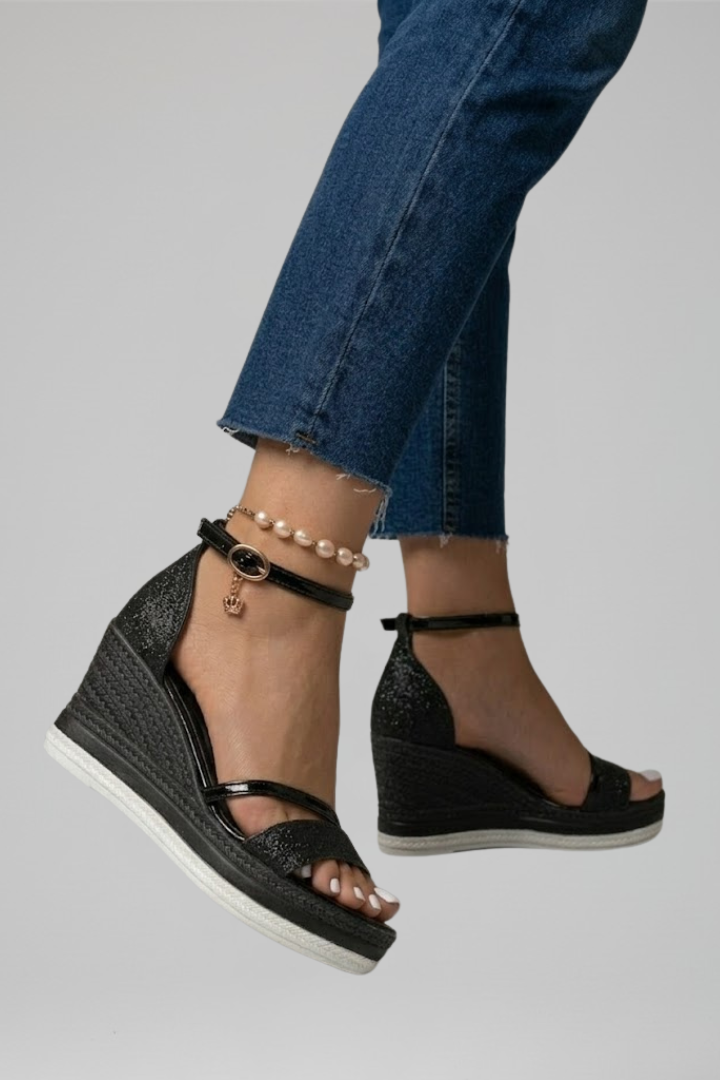 Black wedge sandals for women featuring an adjustable ankle strap, glitter open-toe design, and woven espadrille wedges, perfect for stylish summer outfits. 1