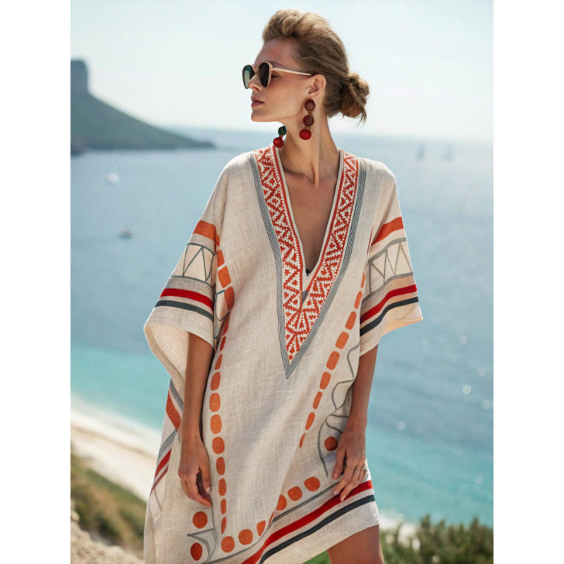 Bohemian kaftan dress featuring intricate embroidery, made from lightweight cotton-linen blend, perfect for summer beach and resort wear. 0