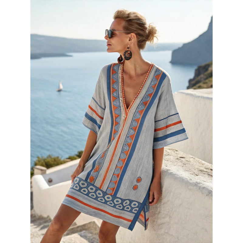 Bohemian kaftan dress featuring intricate embroidery, made from lightweight cotton-linen blend, perfect for summer beach and resort wear. 10