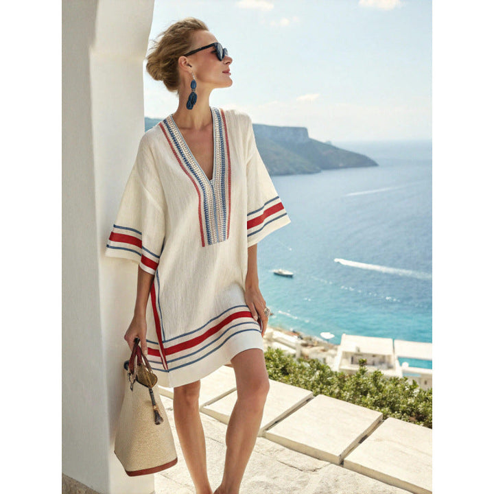 Bohemian kaftan dress featuring intricate embroidery, made from lightweight cotton-linen blend, perfect for summer beach and resort wear. 2