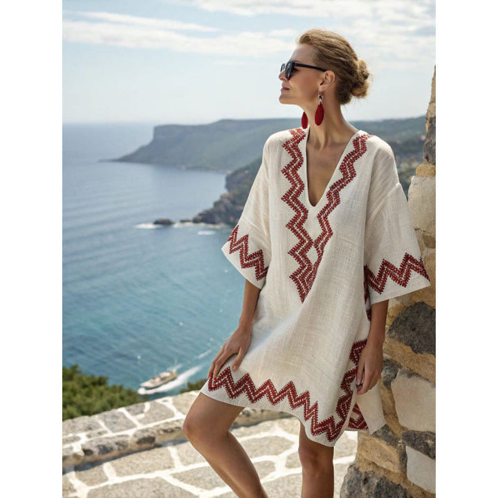 Bohemian kaftan dress featuring intricate embroidery, made from lightweight cotton-linen blend, perfect for summer beach and resort wear. 3