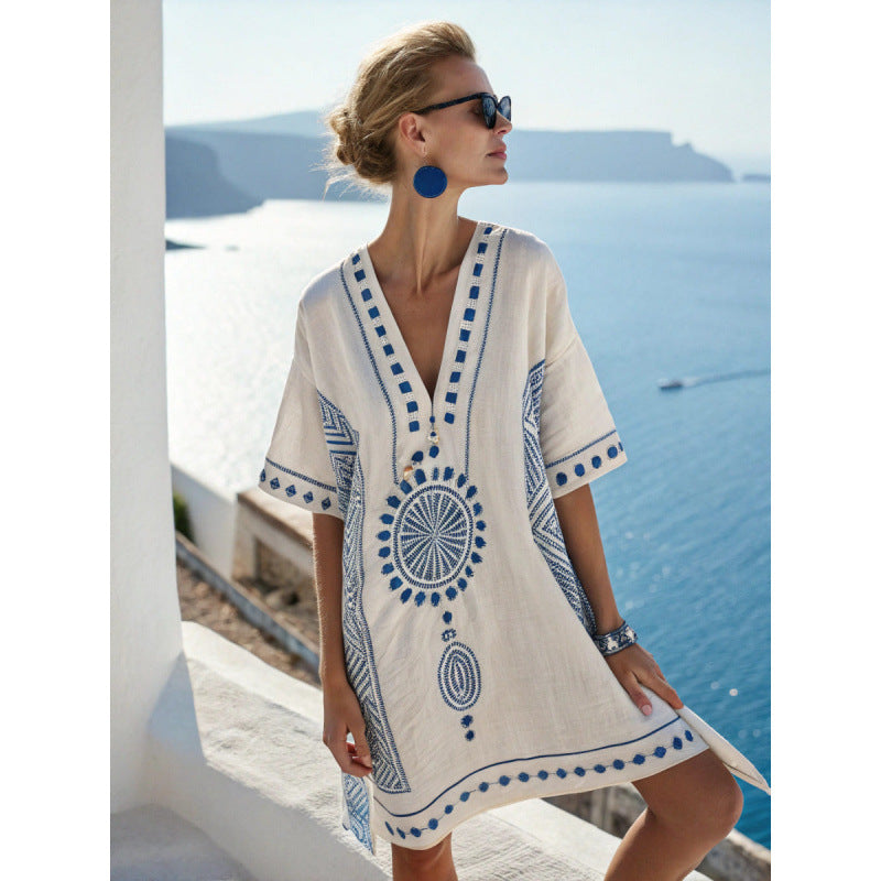 Bohemian kaftan dress featuring intricate embroidery, made from lightweight cotton-linen blend, perfect for summer beach and resort wear. 6