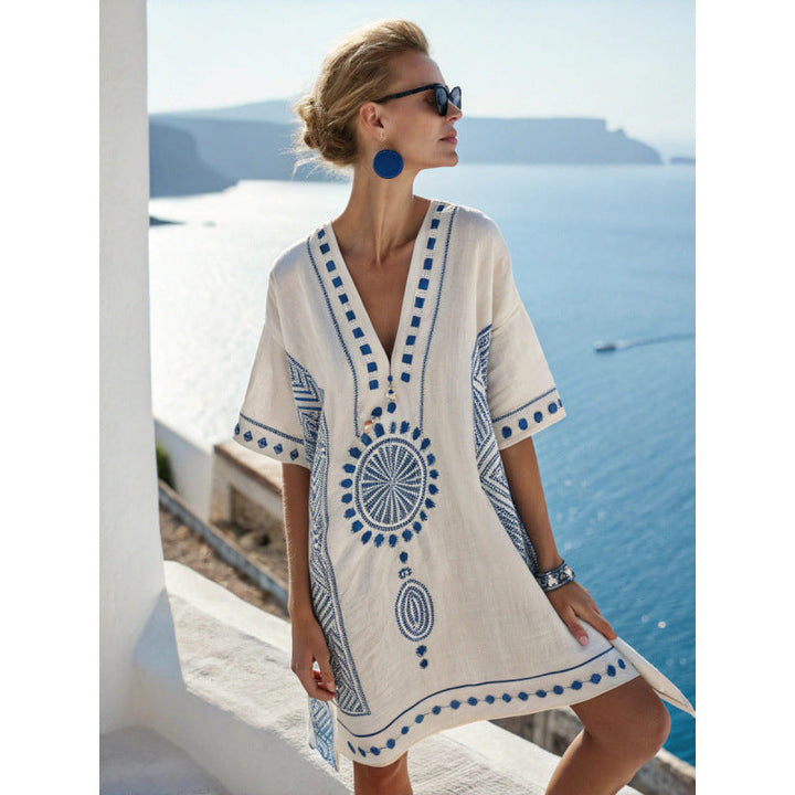 Bohemian kaftan dress featuring intricate embroidery, made from lightweight cotton-linen blend, perfect for summer beach and resort wear. 6