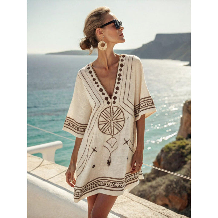 Bohemian kaftan dress featuring intricate embroidery, made from lightweight cotton-linen blend, perfect for summer beach and resort wear. 8