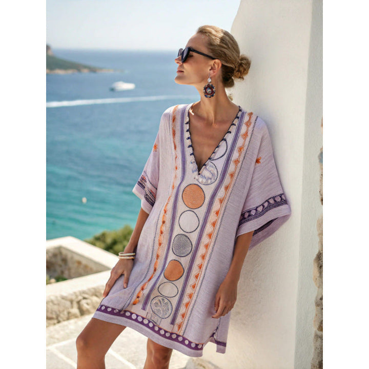Bohemian kaftan dress featuring intricate embroidery, made from lightweight cotton-linen blend, perfect for summer beach and resort wear. 9