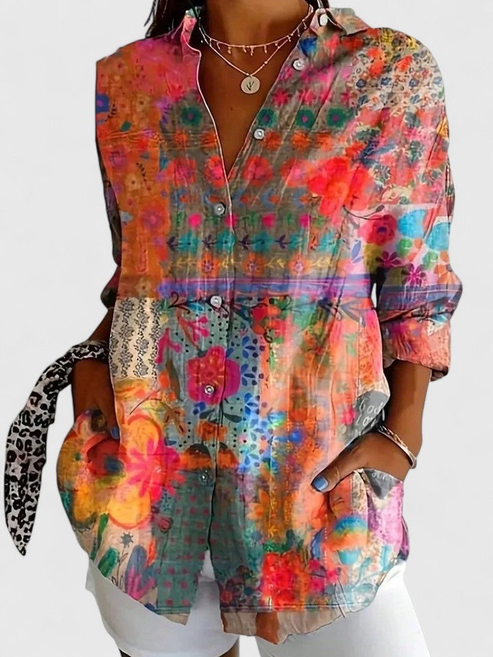 Button-up blouse featuring a vibrant multicolor artistic print, crafted from a relaxed fit cotton blend for comfortable everyday wear. 1