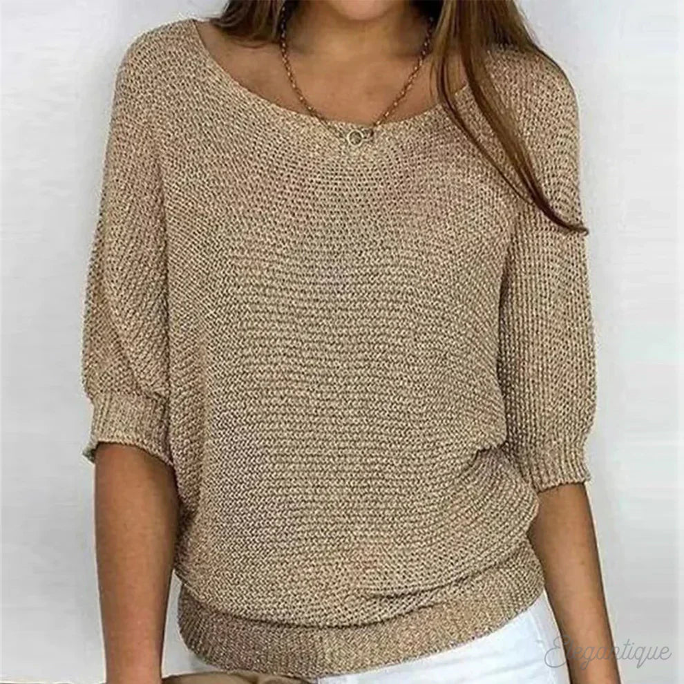 Elegant women's cable knit sweater made from soft knit fabric, featuring a versatile design suitable for all seasons. 0
