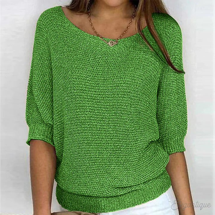 Elegant women's cable knit sweater made from soft knit fabric, featuring a versatile design suitable for all seasons. 3