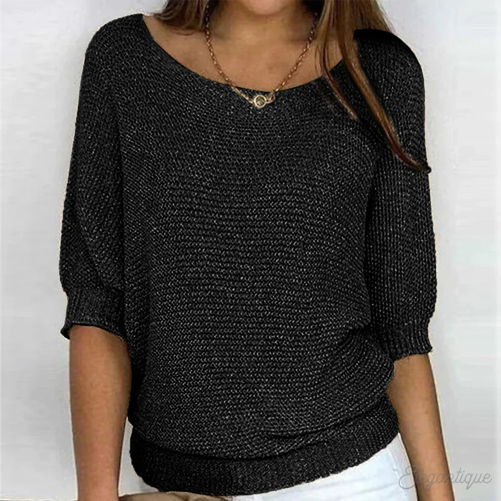 Elegant women's cable knit sweater made from soft knit fabric, featuring a versatile design suitable for all seasons. 4