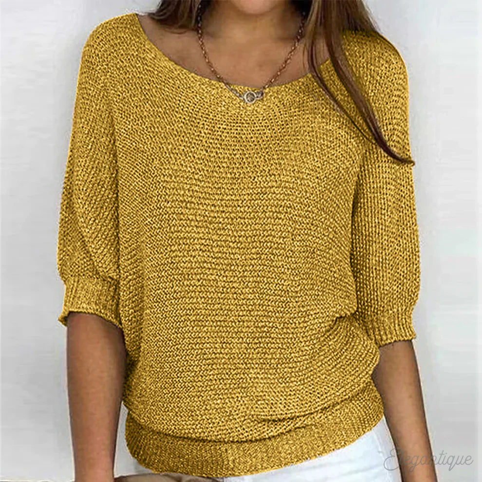Elegant women's cable knit sweater made from soft knit fabric, featuring a versatile design suitable for all seasons. 6