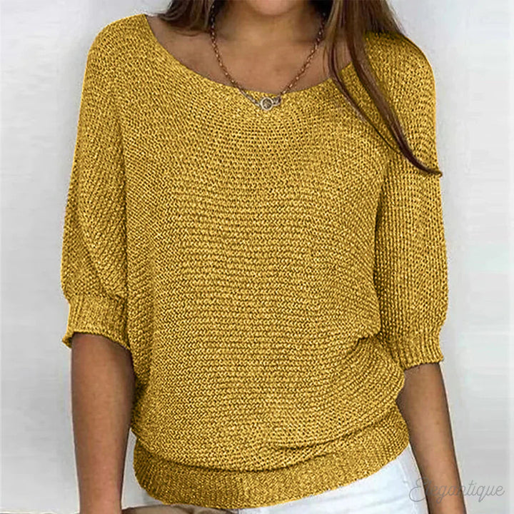 Elegant women's cable knit sweater made from soft knit fabric, featuring a versatile design suitable for all seasons. 6