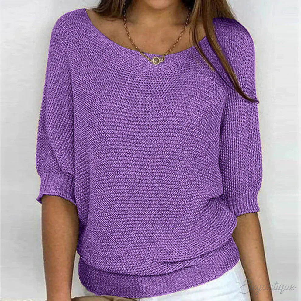 Elegant women's cable knit sweater made from soft knit fabric, featuring a versatile design suitable for all seasons. 7
