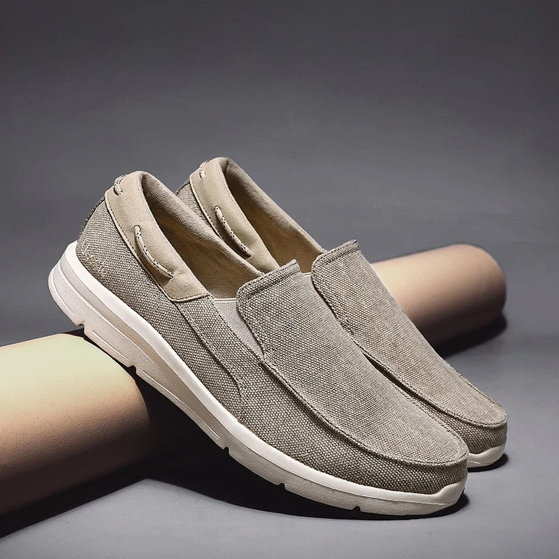 Canvas loafers for women featuring a breathable upper and lightweight sole, designed for casual slip-on comfort. 0