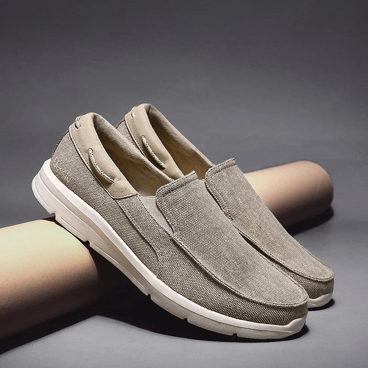 Canvas loafers for women featuring a breathable upper and lightweight sole, designed for casual slip-on comfort. 0