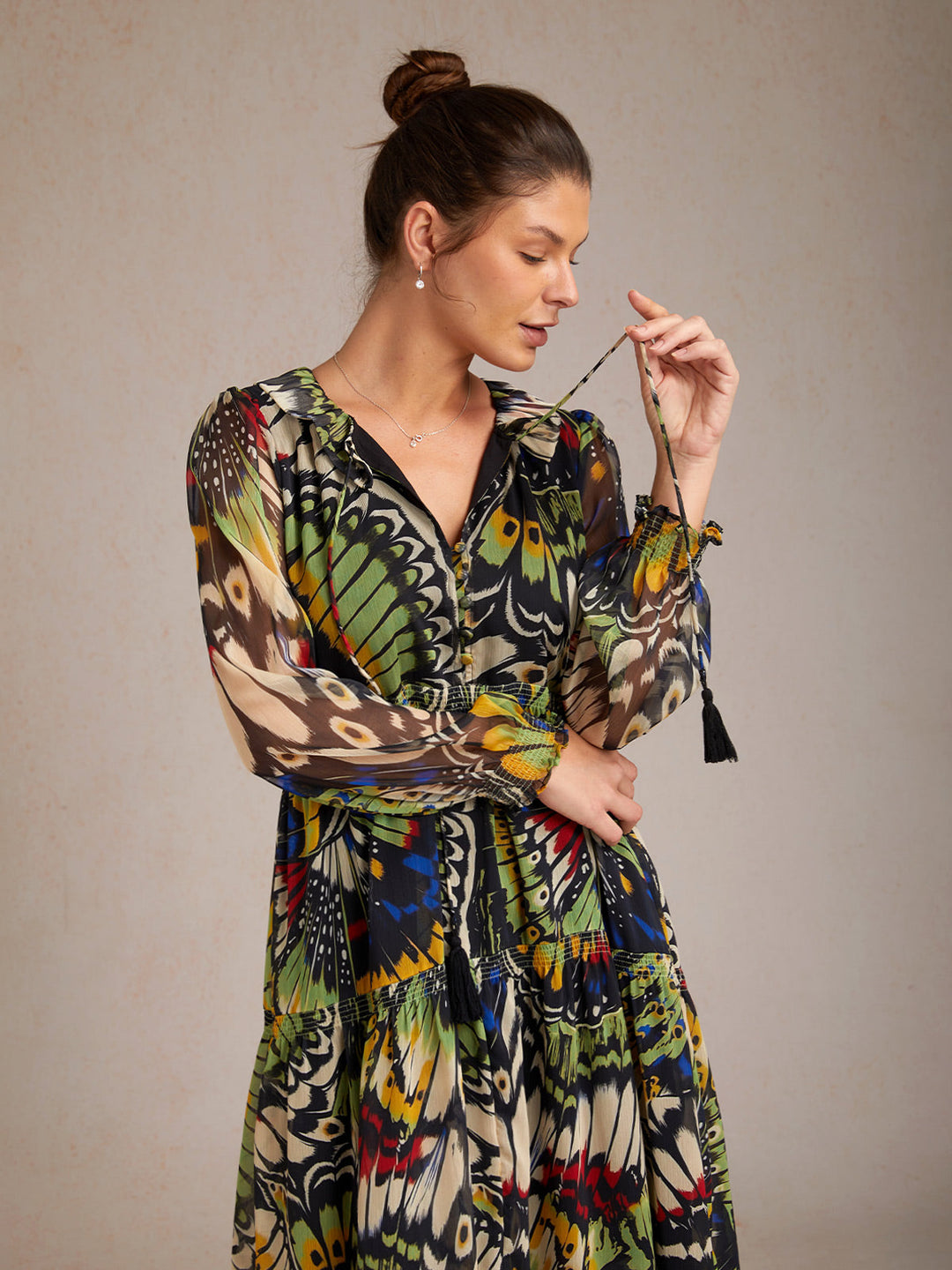 Chiffon maxi dress featuring a ruffle collar and vibrant butterfly print, designed for women seeking a flowing and elegant long dress. 1