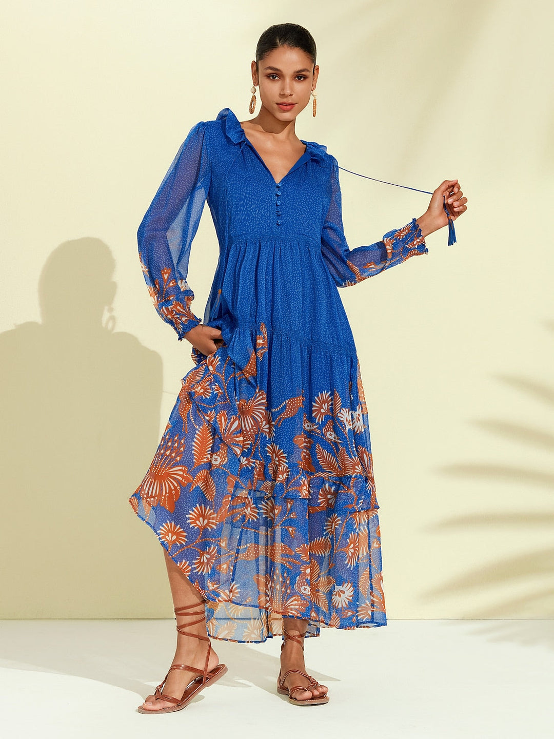Chiffon maxi dress featuring a ruffle collar and vibrant butterfly print, designed for women seeking a flowing and elegant long dress. 9