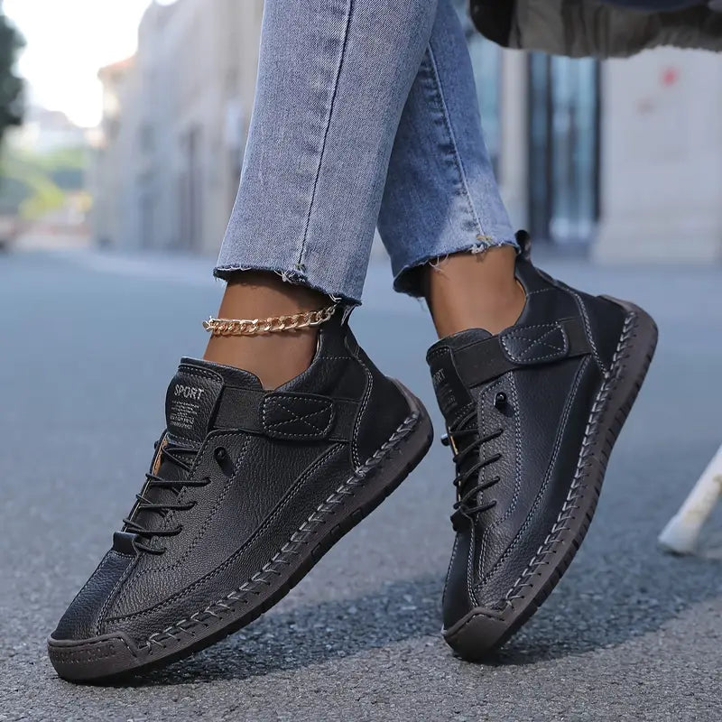 Comfort Support Sneakers featuring breathable leather, shock absorption technology, and an easy on/off design for ultimate comfort and convenience. 2