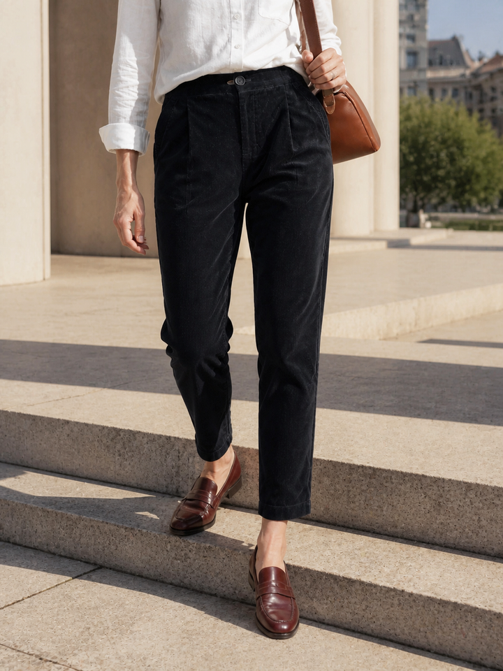 Cotton tapered pants in charcoal black with an elastic waist, designed for a tailored fit for men. 2
