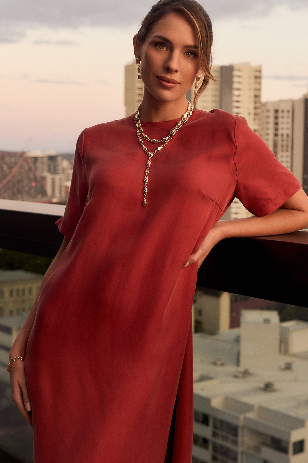 Oversized rust maxi dress for women featuring a side split and round neckline, perfect for casual or dressy occasions. 1
