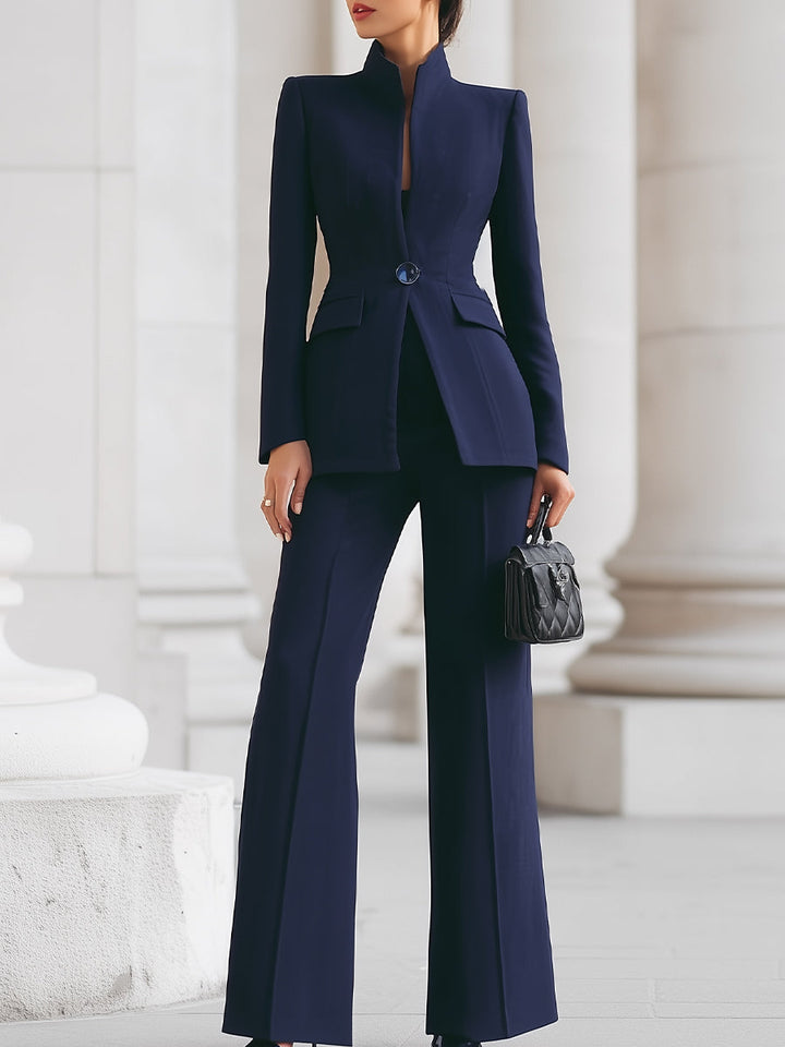 Elegant blazer and trouser suit set featuring a tailored fit and timeless silhouette, perfect for professional and formal occasions. 0