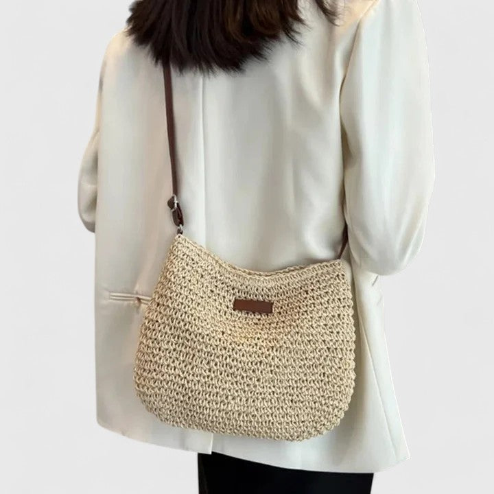 Elegant slouchy bag featuring an adjustable strap and secure zipper, perfect for everyday use with a versatile and stylish design. 0