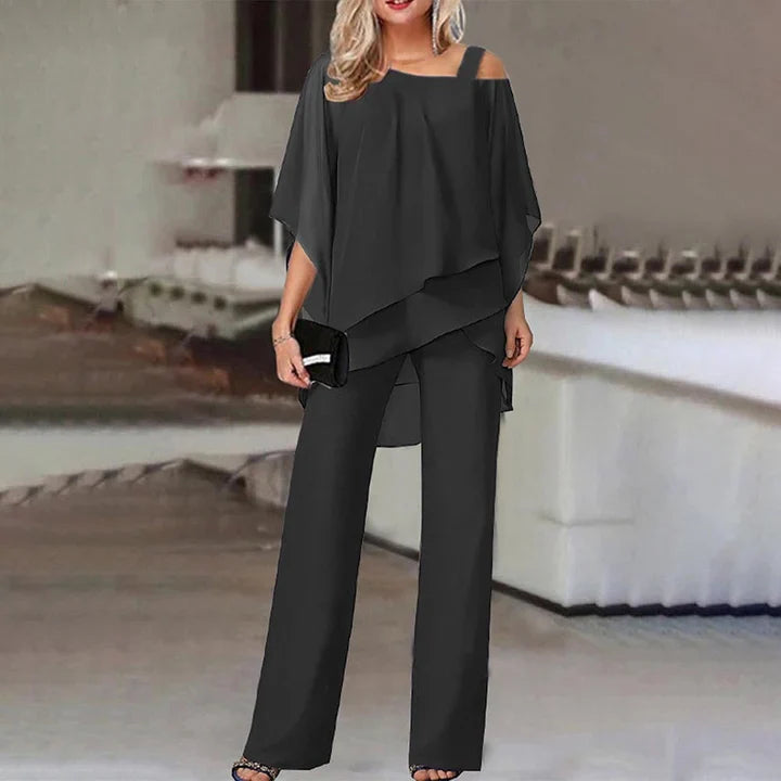 Elegant women's two-piece outfit featuring a flowy overlay top and wide-leg trousers, designed for comfort and style, perfect for all occasions. 1