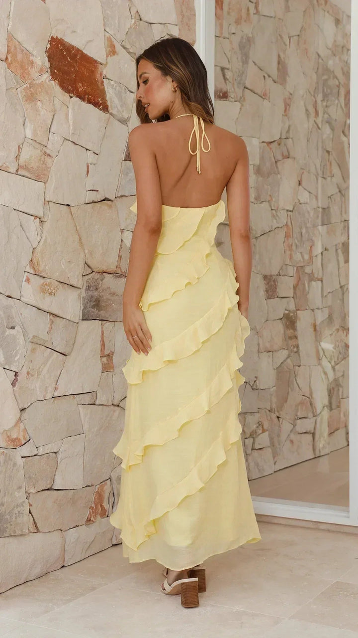 Floral maxi dress with cascading ruffles and halter neckline in lightweight soft lemon color for women. 3