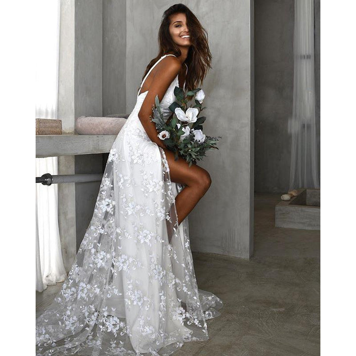 Floral maxi dress featuring a thigh split and open back, perfect for wedding guests and formal occasions, showcasing elegance and style. 1