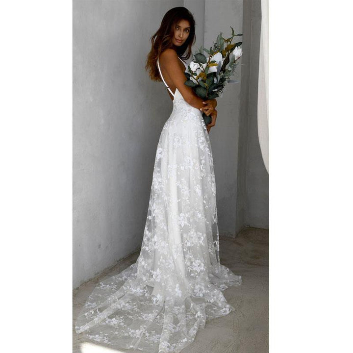Floral maxi dress featuring a thigh split and open back, perfect for wedding guests and formal occasions, showcasing elegance and style. 3