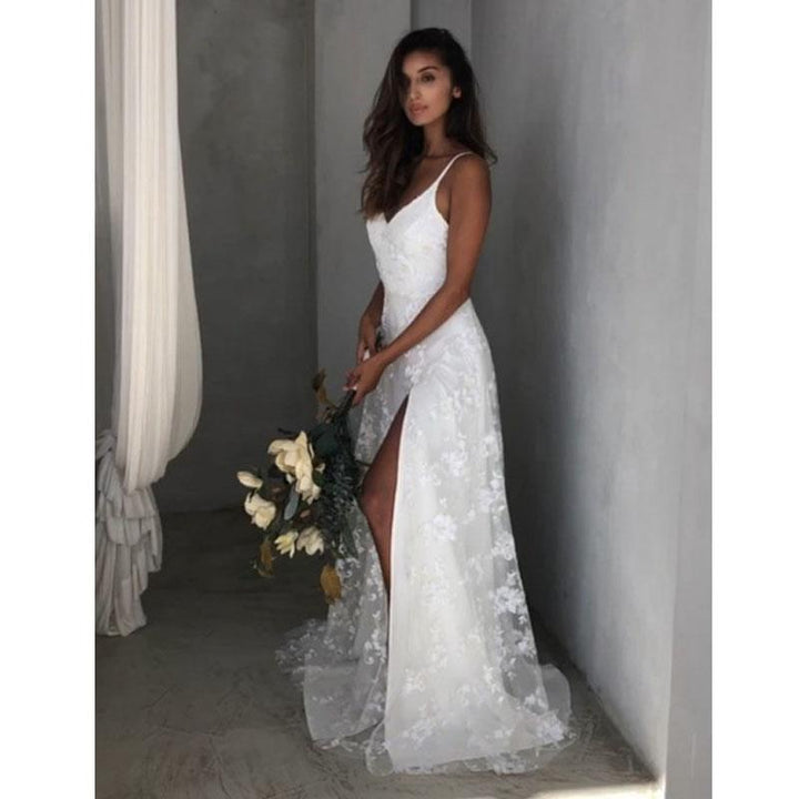 Floral maxi dress featuring a thigh split and open back, perfect for wedding guests and formal occasions, showcasing elegance and style. 4