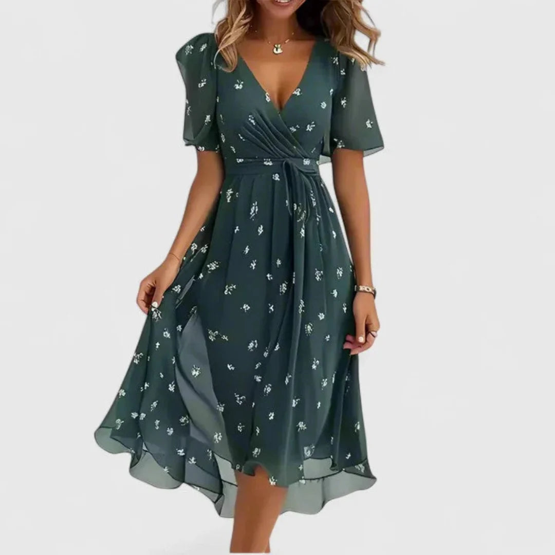 Floral midi dress featuring a V-neckline, elegant flowing fit, perfect for wedding guests or formal occasions. 2