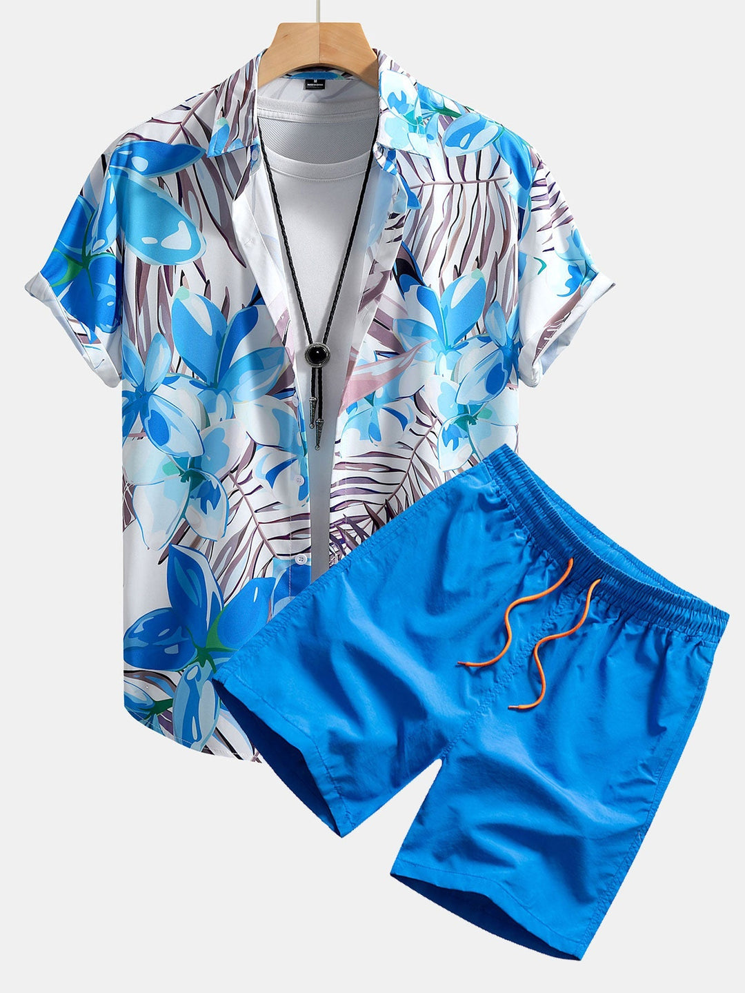 Floral print shirt and swim shorts set in a comfortable regular fit, made from 100% polyester and nylon for a stylish summer look. 2