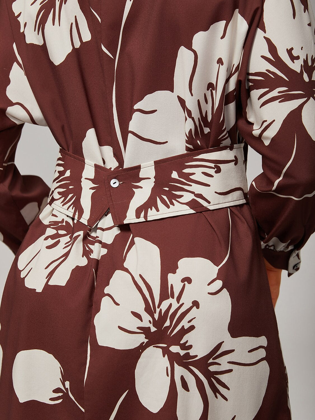 Floral shirt dress featuring a button-down front and raglan sleeves, designed in a brown rayon fabric, perfect for summer wear for women. 1