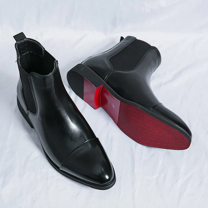 Genuine leather Chelsea boots for men and women in classic black design, offering timeless comfort and style for any occasion. 0