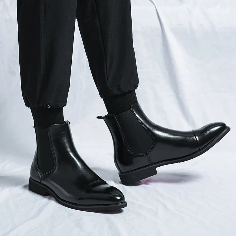 Genuine leather Chelsea boots for men and women in classic black design, offering timeless comfort and style for any occasion. 2
