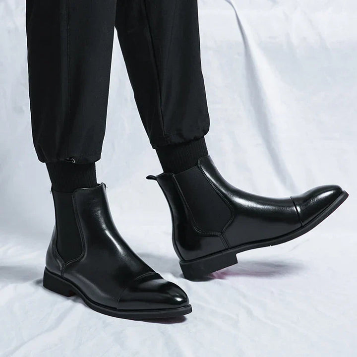 Genuine leather Chelsea boots for men and women in classic black design, offering timeless comfort and style for any occasion. 2