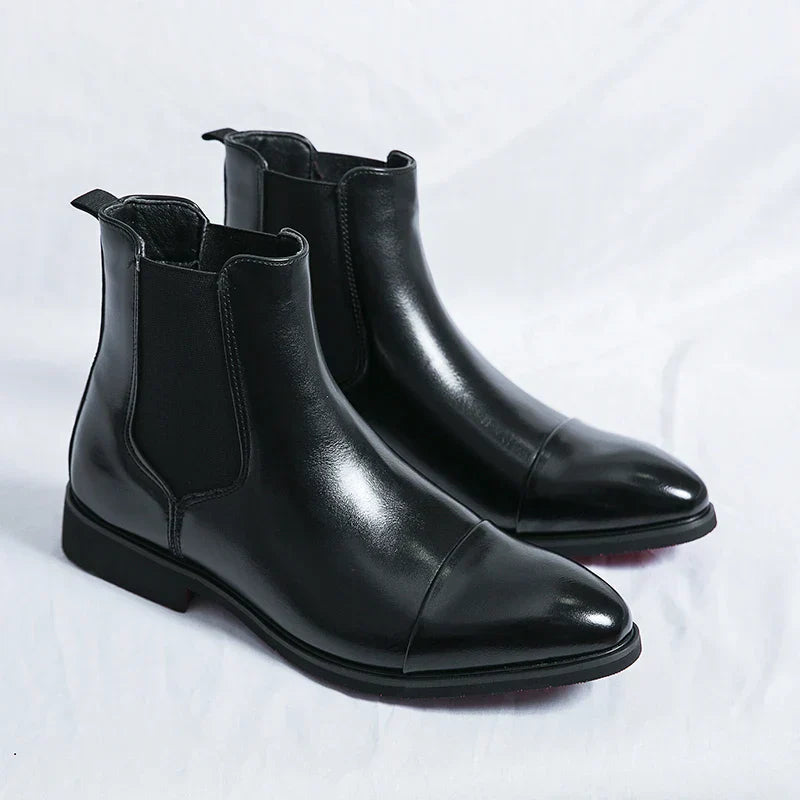 Genuine leather Chelsea boots for men and women in classic black design, offering timeless comfort and style for any occasion. 3