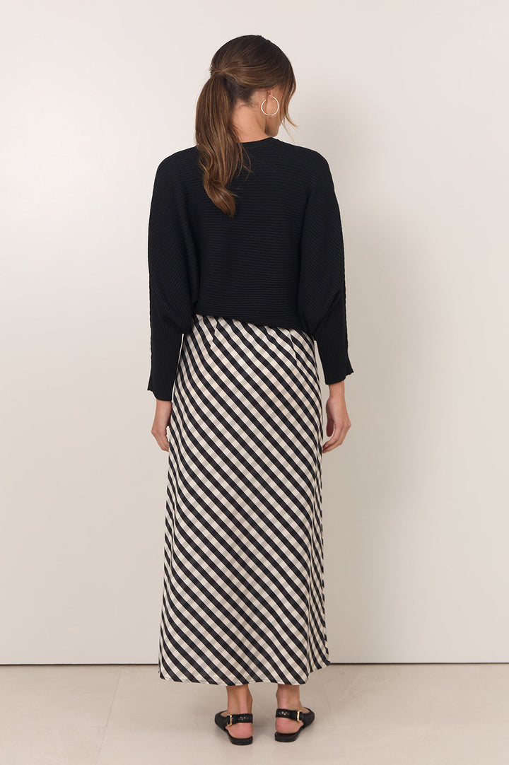 Gingham maxi skirt featuring an adjustable waistband and bias-cut design in black and white, perfect for stylish women's outfits. 5