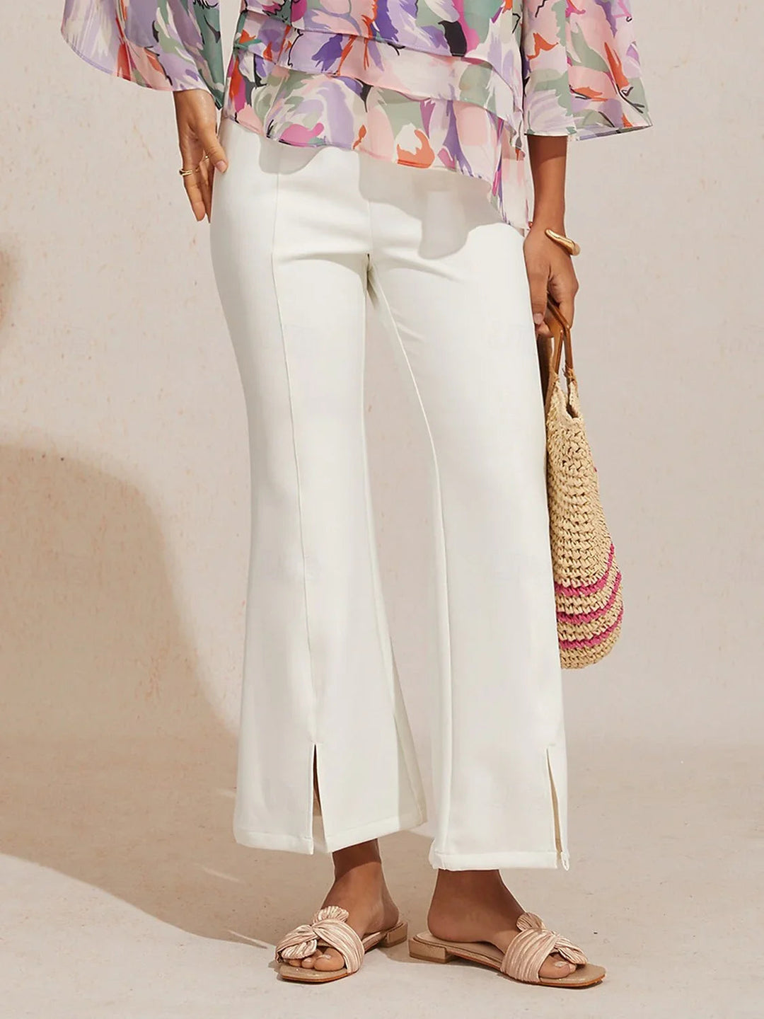 High-waist cropped flared pants for women featuring a stylish split detail, made from soft stretch fabric for comfort and versatility. 3