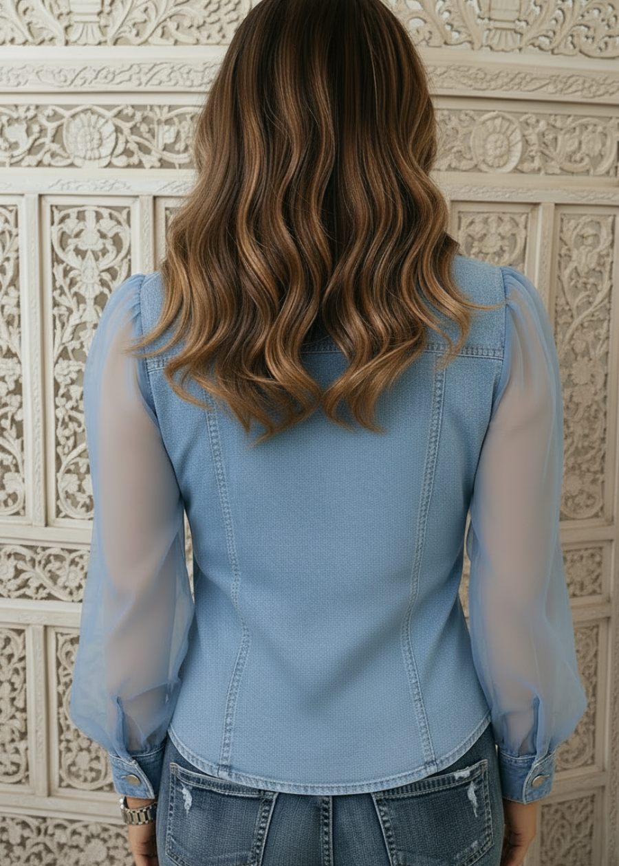 Light-wash denim top for women featuring a V-neck, sheer sleeves, and a slim fit button-down design, perfect for casual and stylish outfits. 2