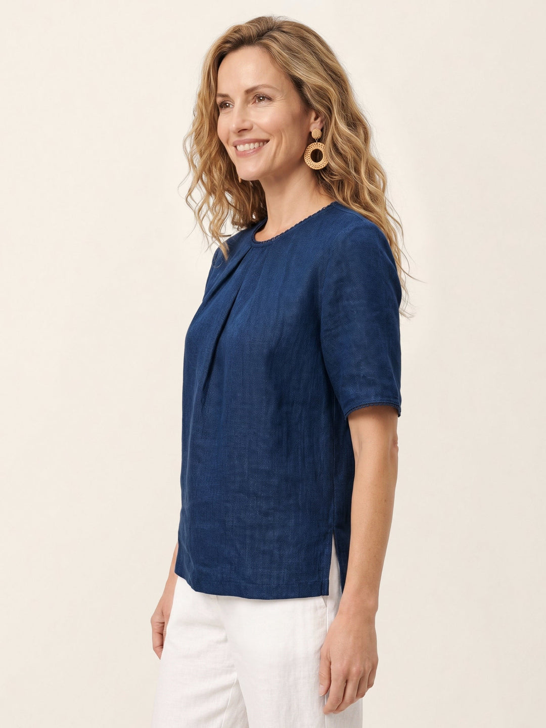 Elegant linen blend blouse featuring pintuck details and delicate lace trim, designed with short sleeves and a round neck for a stylish and comfortable fit. 4