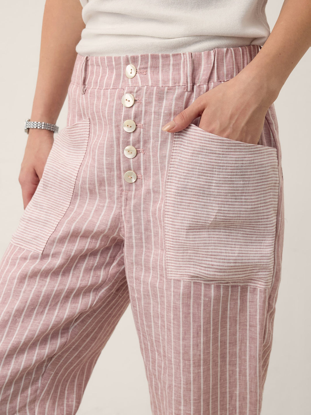 Linen pants for women featuring a tapered fit, stylish patch pockets, and a yarn-dyed striped design, crafted from 100% breathable linen for 4