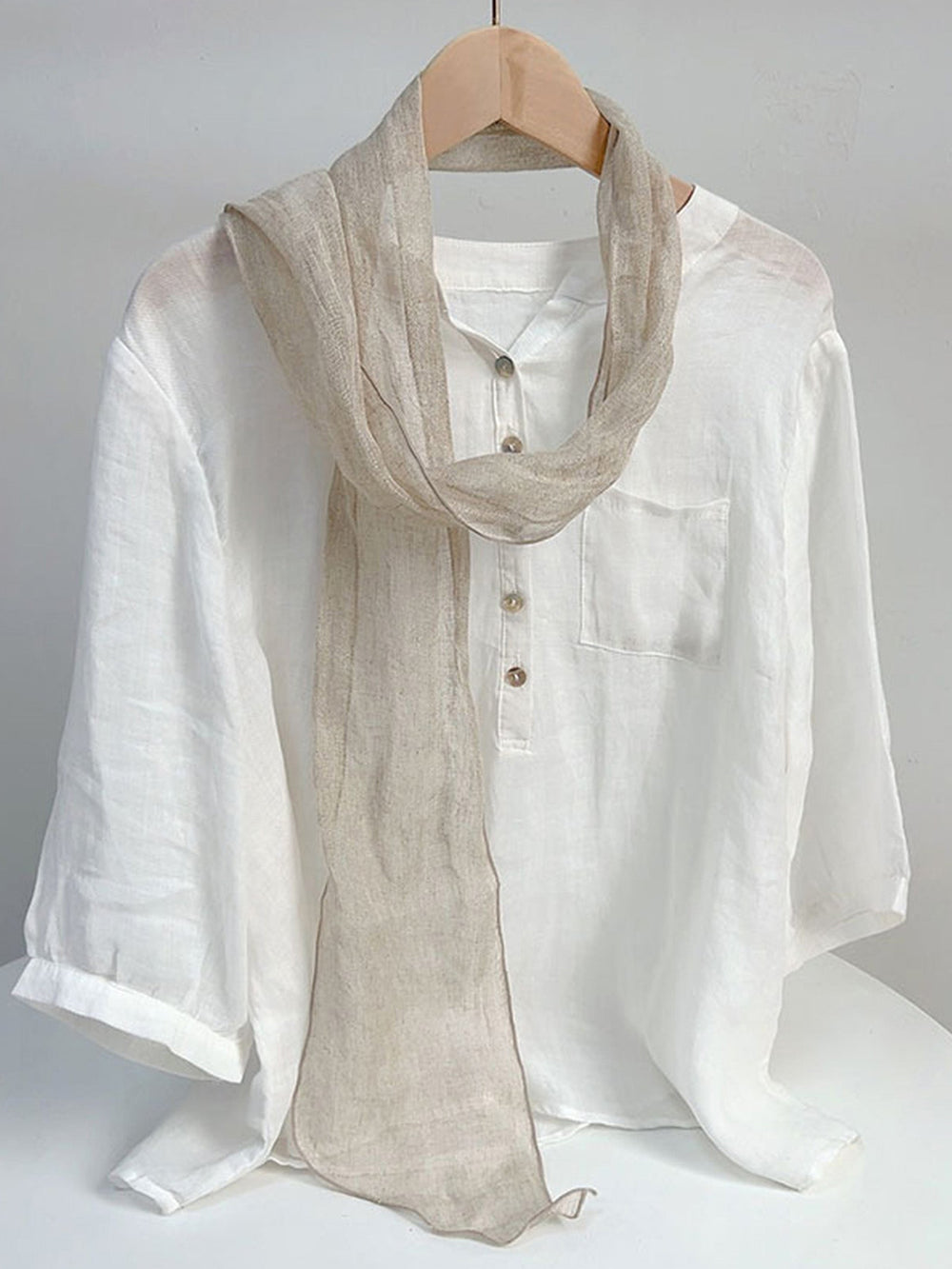 Linen scarf featuring a hand tie-dye finish in various colors, showcasing a soft and lightweight design perfect for year-round wear. 1