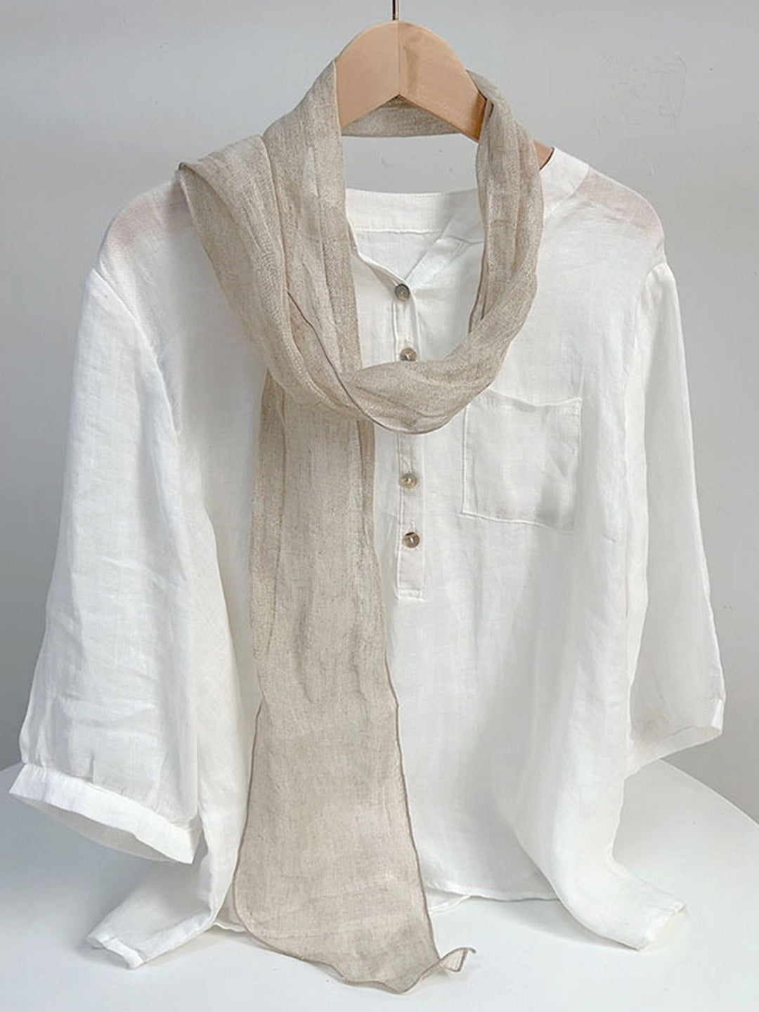 Linen scarf featuring a hand tie-dye finish in various colors, showcasing a soft and lightweight design perfect for year-round wear. 1