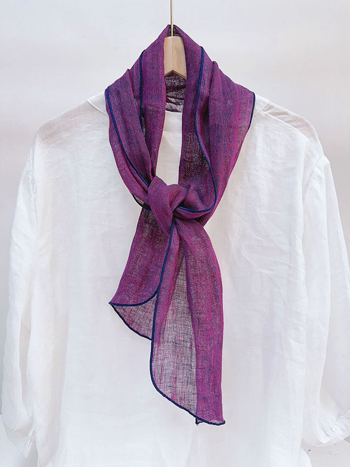 Linen scarf featuring a hand tie-dye finish in various colors, showcasing a soft and lightweight design perfect for year-round wear. 2
